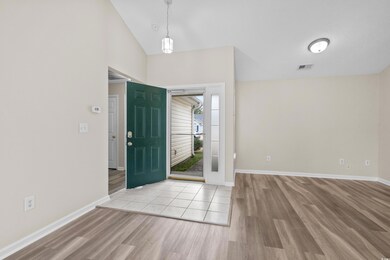 Entrance foyer featuring a textured ceiling, high 