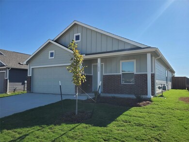 View of front of house featuring board and batten 