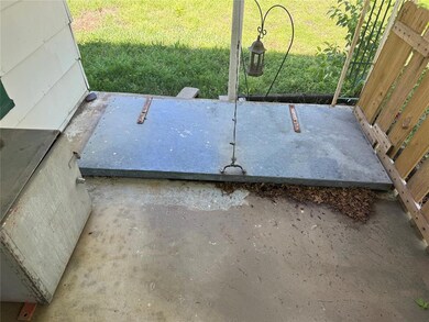 View of storm shelter with a yard