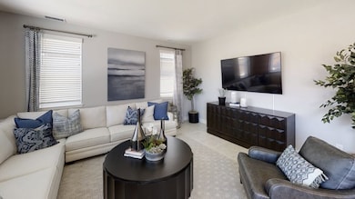 Situated among the open floorplan, the Great Room allows for seamless access to the kitchen and dini