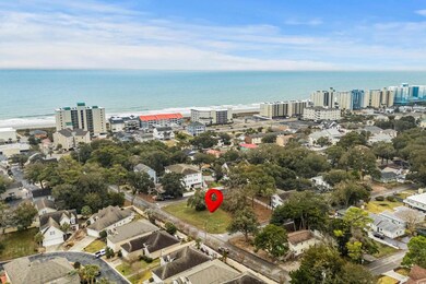 Drone / aerial view with a water view and a beach 