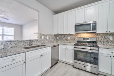 Kitchen featuring light hardwood / wood-style floo