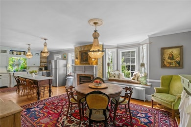 Front to back kitchen and dining with gas burning fireplace and window seat.