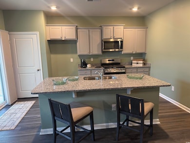 Kitchen with a breakfast bar, stainless steel appl
