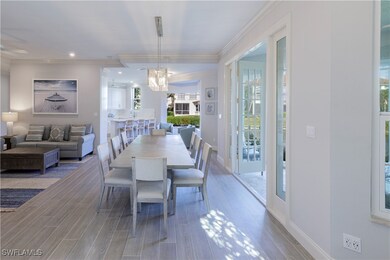 Dining room with crown molding, a wealth of natura