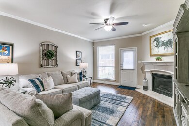 Living room with ceiling fan, dark hardwood / wood