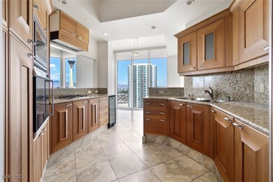 Kitchen with tasteful backsplash, brown cabinets,