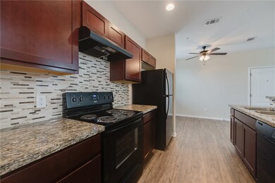 Kitchen featuring light wood-type flooring, visibl