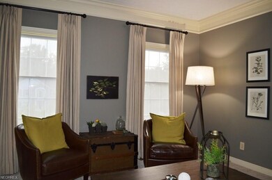 Living room is bright with large windows