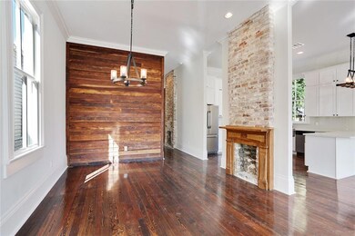 Dining room with beautiful accent wall.