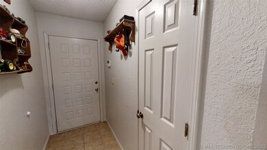 Entry hallway with coat closet