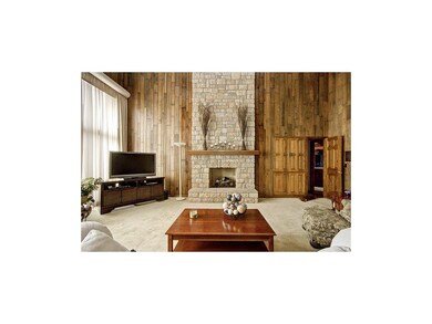 Gorgeous stacked stone fireplace in the great room