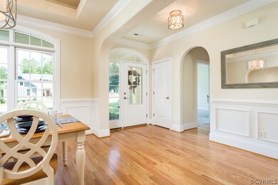The arch leading from the entry to the office is just one of seven you will find throughout this amazing home.
