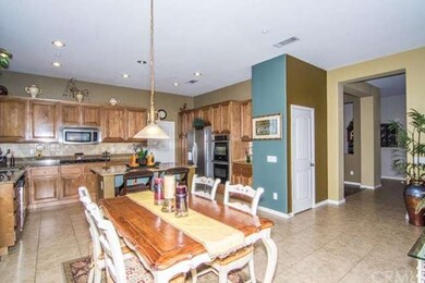 Completely tiled breakfast area and island kitchen
