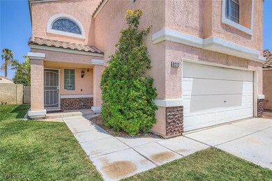 Entrance to property with an attached garage, stuc