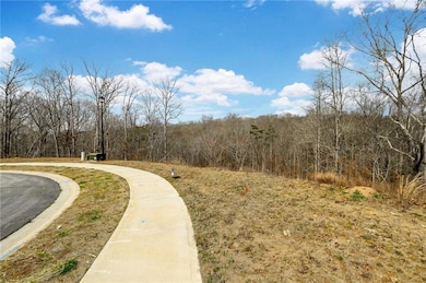 View of property's community with a wooded view