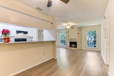 Unfurnished living room with ceiling fan, a textu