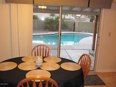 Kitchen table and view to pool