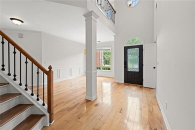Entrance foyer with a high ceiling, decorative col