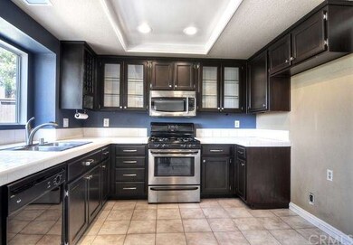 Modern touches in the kitchen include re-stained c