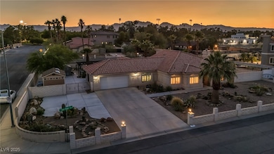 View of front facade featuring a garage, a tiled r