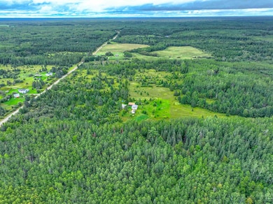 View of property location featuring a forest