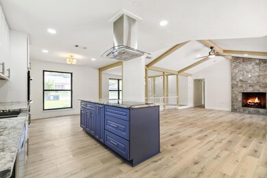 Kitchen with ceiling fan, light hardwood / wood-st