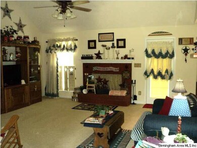 Living with wood burning fireplace.