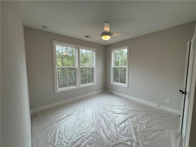 Empty room with visible vents, baseboards, and cei