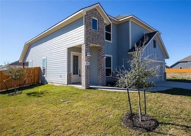 Back of property with board and batten siding, an