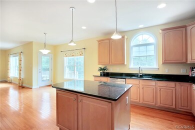 View of spacious eat in area; door leading to the deck