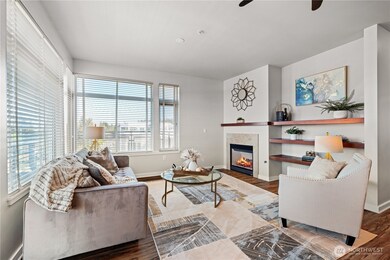 Open floor plan, cozy gas fireplace, and light-filled rooms.