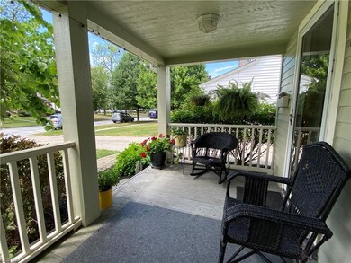Relax on the comfortable front porch with easy care composite deck flooring.