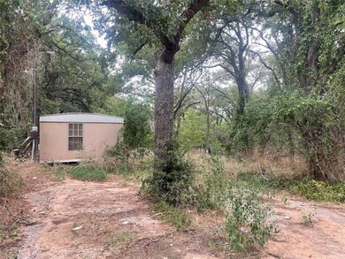 View of yard with a storage shed