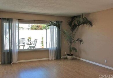 Large living area looks out to patio.