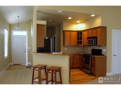 front entry hall and upscale kitchen