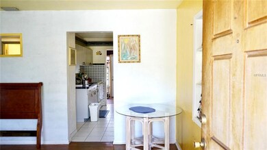 Front door looking through living room into kitchen.