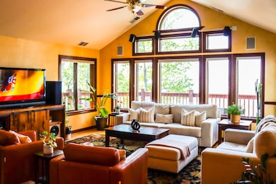 Living room featuring high vaulted ceilings
