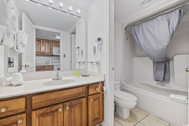 Full bathroom featuring vanity, tile patterned flo