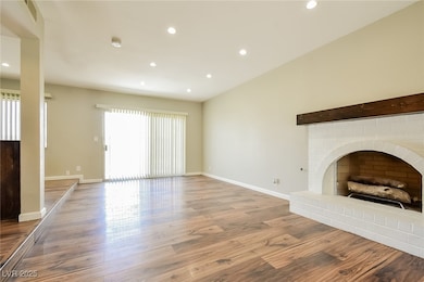 Unfurnished living room with recessed lighting, ba