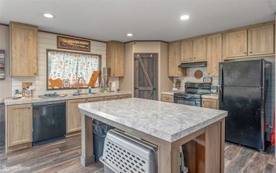 Walk in pantry in the heart of the kitchen, ship lap walls make for great farmhouse feel.