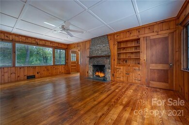 Wood burning fireplace and built-ins.  Door to the