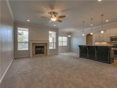 Living Room. Large living area with gas log fireplace.  Open to the kitchen and breakfast area.