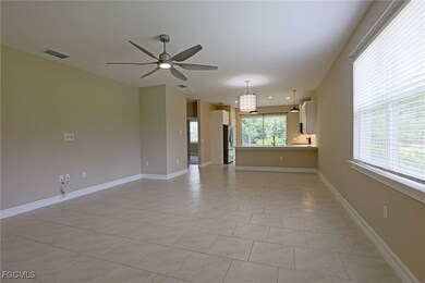 Unfurnished living room with ceiling fan and light