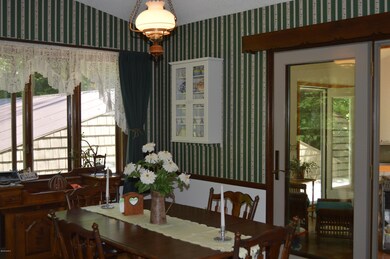 dining opens toward sunroom
