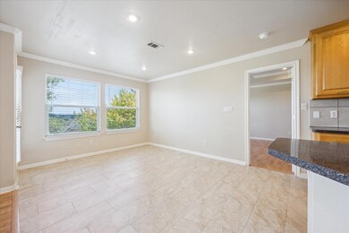Unfurnished living room featuring ornamental mold