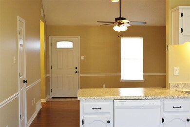 Step into this open concept living room with tall 