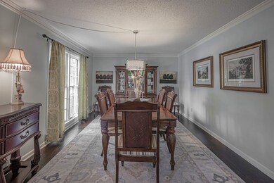 Dining room featuring a textured ceiling, ornament