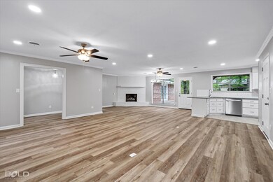 Unfurnished living room with a sink, ornamental mo