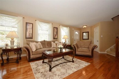 LIVING ROOM WITH WIDER PLANK HARD WOOD FLOORS